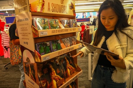 A fan looks at copies of the album at the Target release party in Times Square, New York.