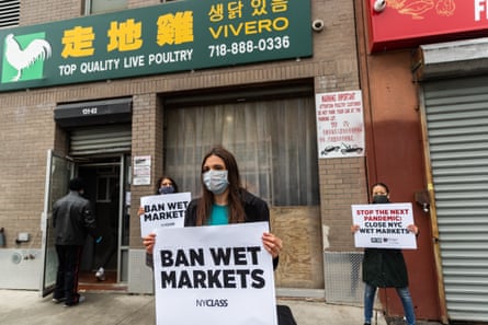 Members of People for NYCLASS protest outside a live-animal market on April 21, 2020 in the Queens borough of New York City. PETA supporters and members of Slaughter Free NYC and other animal rights groups, concerned about the possible spread of disease, are holding protests to shut down live-animal markets.