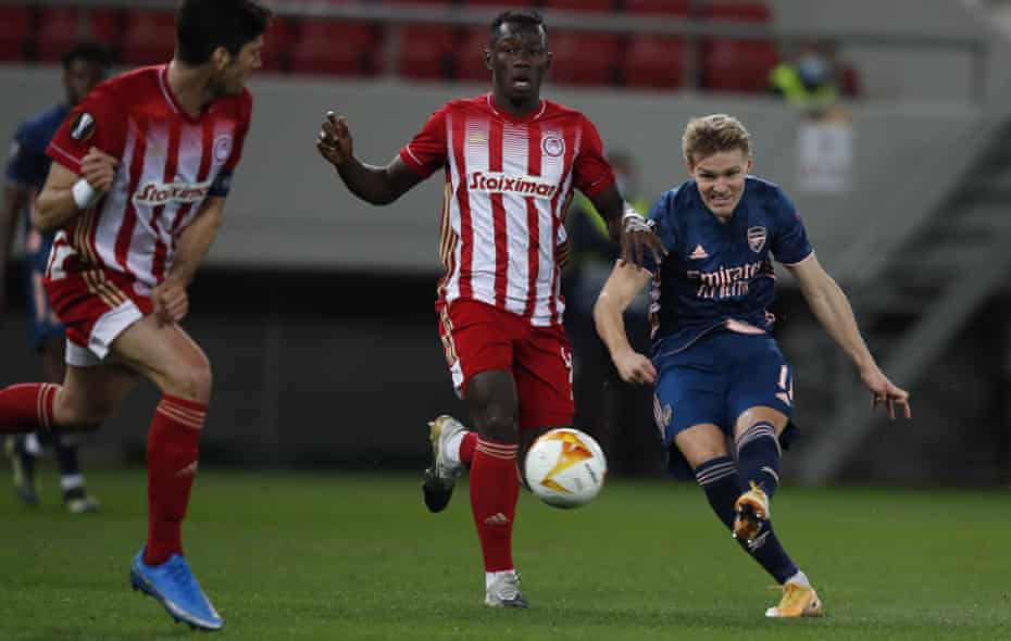 Martin Ødegaard (right) opens the scoring for Arsenal.