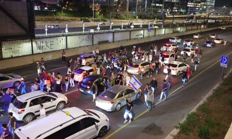 Protesters block the Ayalon highway where they call for the immediate release of Israeli hostages held by Hamas in Gaza, during a protest in Tel Aviv, Israel.