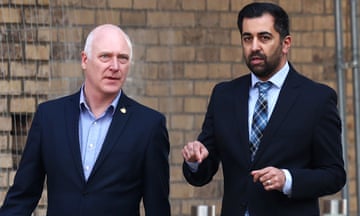 Scotland's First Minister Humza Yousaf visits a housing development in Dundee.