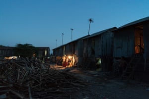The houses of debt-bonded brick workers and their families stand nestled on a kiln site