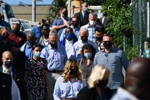 Joe Biden, along with Alexandria Ocasio-Cortez and Chuck Schumer, tours a neighborhood affected by Hurricane Ida in Queens, New York.