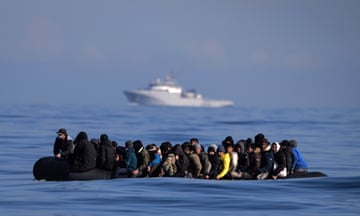 An inflatable dinghy carrying around 65 migrants crosses the Channel on 6 March.