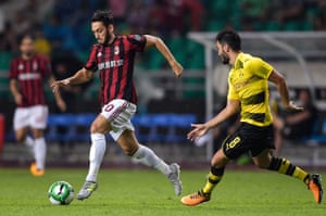 Hakan Calhanoglu, left, in action against Dortmund at the International Champions Cup in Guangzhou, China.
