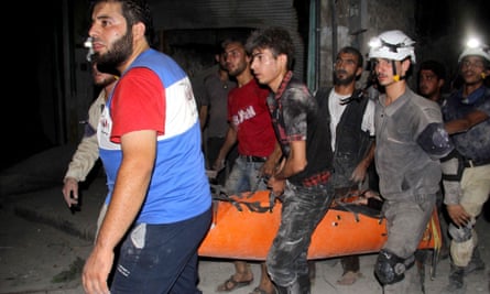 Syrian civil defence personnel carry an injured man following a reported barrel bomb attack in Aleppo. Assad’s regime has launched relentless barrel bombing campaigns aimed at making life unbearable for civilians under rebel control