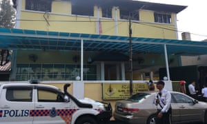 Police visit the Darul Quran Ittifaqiyah religious school in Malaysia after a fire kills 24.