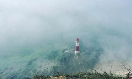 Beachy Head Lighthouse surrounded by mist.