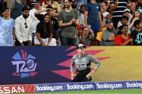 Mitchell Santner of New Zealand looks dejected after dropping a catch.
