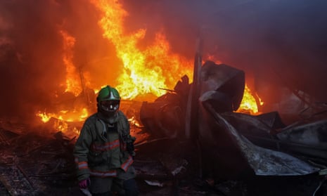 A firefighter works in the aftermath of a Russian missile strike in Kharkiv, Ukraine’s second-largest city, on Saturday