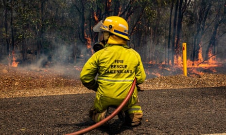 A firefighters working to control a bushfire in Deepwater, central Queensland