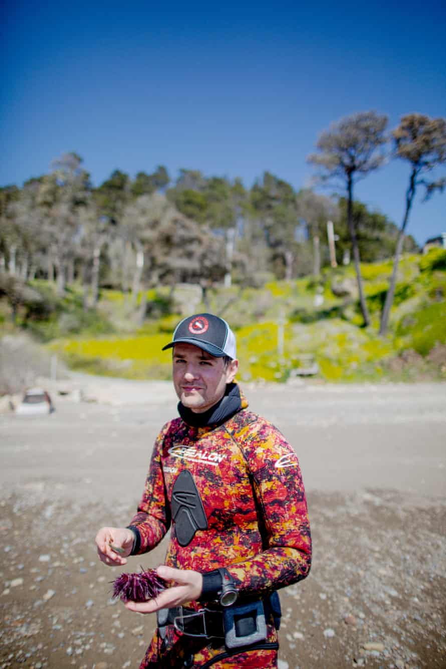 Ali Bouzari, culinary scientist, wears his underwater sea pirate gear while scooping fresh roe from a sea urchin.