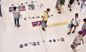 Shoppers look at protest notes inside The New Town Plaza Mall, in Sha Tin.