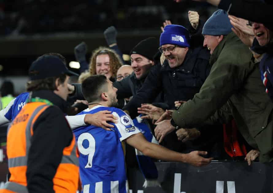 Brighton’s Neal Maupay celebrates scoring their equaliser with fans.