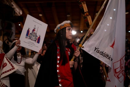 people parade in traditional dress