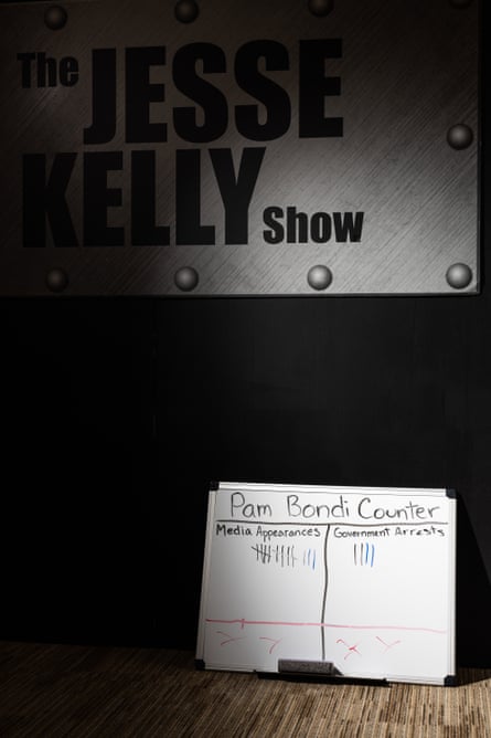 A white board counting former attorney general Pam Bondi’s media appearances and government arrests sits on the floor