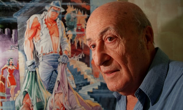Will Eisner stands next to a poster of The Spirit, the masked comic book hero he created in the 1930.