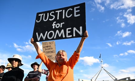 A woman holds up a sign saying: ‘Justice for women.’