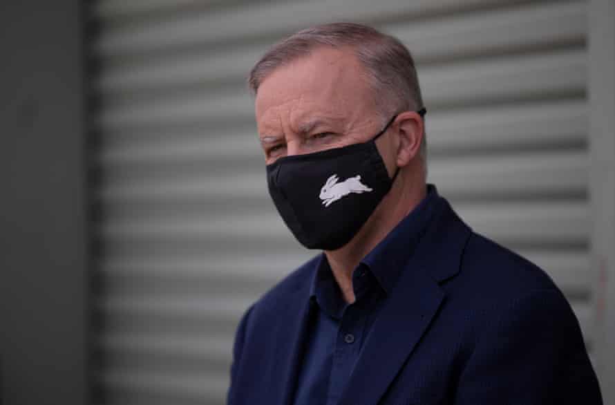 Anthony Albanese wearing a mask and looking at camera