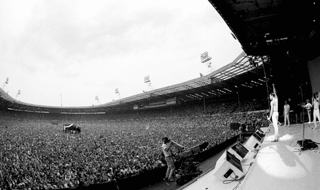 Members of Queen on stage at Live Aid, Wembley stadium, London, 13th July 1985.