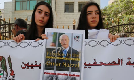 Palestinian journalists protest in support of their colleague Omar Nazzal after he was detained the previous day by Israeli forces.