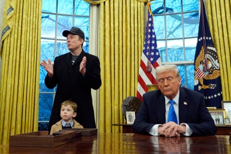 President Donald Trump listens as Elon Musk, with his son X Æ A-Xii, speaks in the Oval Office at the White House, 11 Feb, 2025, in Washington.