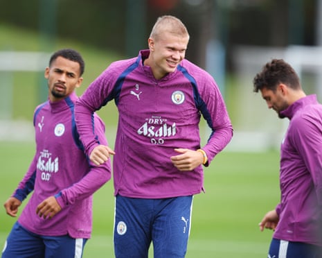 Erling Haaland, in purple top, smiles during a training session