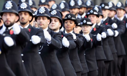 Graduating Met police officers take part in a passing out parade in Hendon, north London