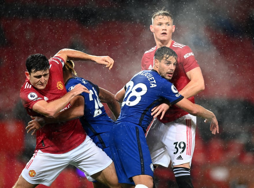 Harry Maguire and Scott McTominay of Manchester United collide with Reece James and Cesar Azpilicueta of Chelsea during their clash at Old Trafford.