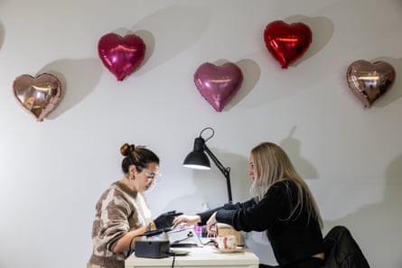 Mariya Hull receives an e-filed manicure from Huck in her salon in Alexandria, Sydney.