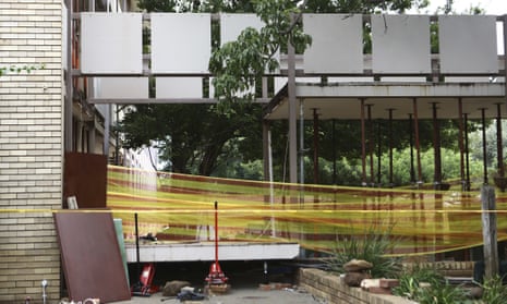 Police tape cordons off the site of a walkway collapse at the Driehoek High School in Vanderbijlpark, South Africa, where at least 3 students were killed.