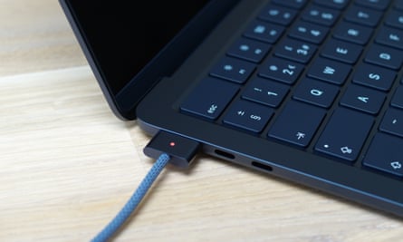 A photo showing the MacBook Air charging via a MagSafe cable.