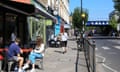 Colourful shops and cafes on the Caledonian Road near Caledonian Road &amp; Barnsbury Overground station, in Islington, north London, UK<br>2JDF56A Colourful shops and cafes on the Caledonian Road near Caledonian Road &amp; Barnsbury Overground station, in Islington, north London, UK