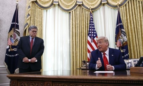 Donald Trump with William Barr at the White House in July. The DoJ is investigating an alleged ‘bribery for pardon’ scheme.
