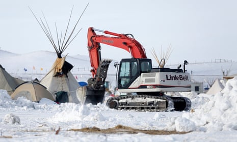 Crews remove waste from the camp opposing the Dakota Access pipeline near Cannon Ball, North Dakota.