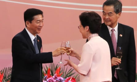 Hong Kong’s chief executive Carrie Lam toasts with Luo Huining at a flag-raising ceremony marking the anniversary of the Hong Kong handover to China.