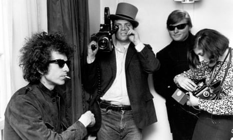 Bob Dylan with DA Pennebaker in the background filming Don’t Look Back. Photo by Michael Ochs Archives/Getty Images
