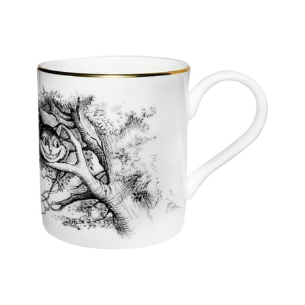 White mug with black Cheshire cat illustration