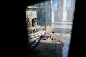 Shattered reinforced glass and debris litter the east steps in the US Capitol on 7 January.