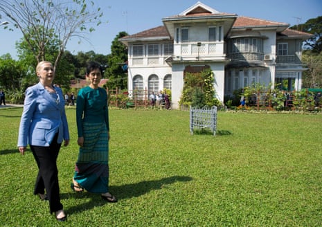 US Secretary of State Hillary Clinton (L) and Myanmar's pro-democracy leader Aung San Suu Kyi tour the grounds after their meeting at Suu Kyi's house in Yangon, 2011