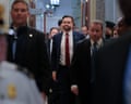 JD Vance in a suit surrounded by dozens of people walking through the Rotunda
