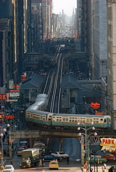Chicago, 1967, James L. StanfieldThe historic Chicago “L” elevated rapid transit system encircles thirty-five blocks of shops, offices, and hotels, as it navigates downtown.