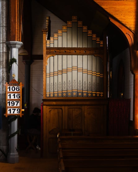 Man playing organ at church