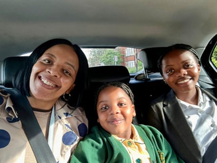 Nothabo Zandile Tshuma, 42, Nala, five, and Natalie, 15, smiling in the back of a car