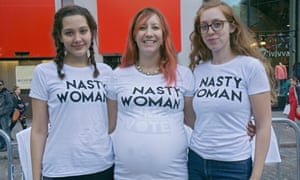 Three New Yorkers selling NASTY WOMAN tee shirts on election day 2016 with the proceeds going to charity. In New York City.H8BHEG Three New Yorkers selling NASTY WOMAN tee shirts on election day 2016 with the proceeds going to charity. In New York City.