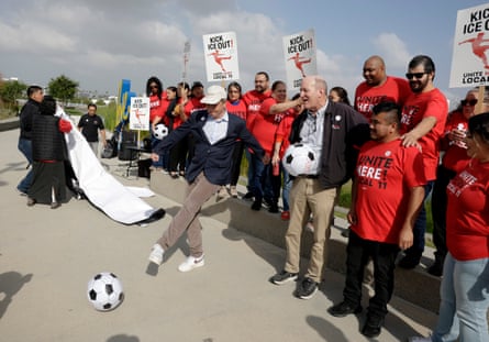 a man kicking a soccer ball
