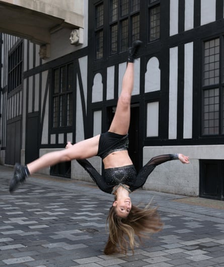 Maddie Hart, 23, a member of the Unity Allstars Black cheerleading team, performing off Regent Street, central London