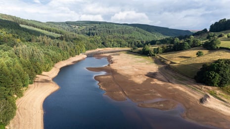 Aerial view over Ladybower Reservoir showing extremely low water levels during drought in summer heatwave, Derwent Valley, Derbyshire, UK. 20th August 2022.
