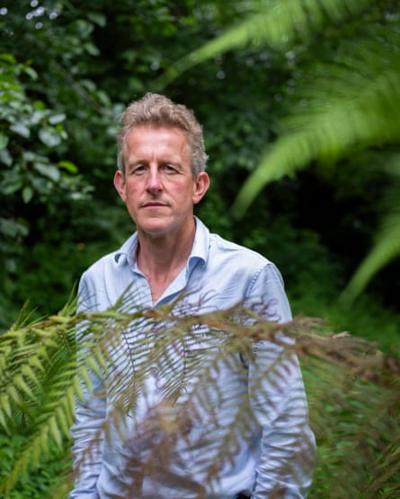 Timothy Lenton standing in a garden