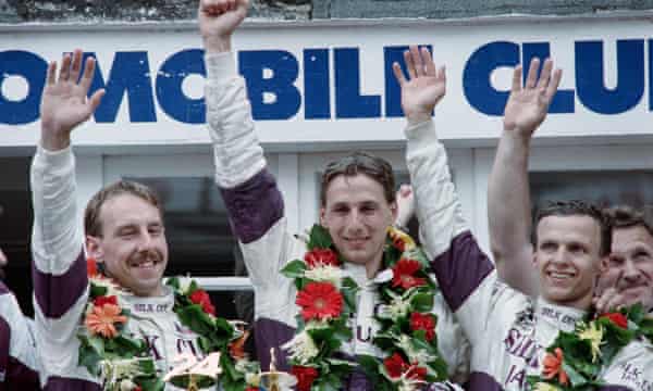 Johnny Dumfries, center, celebrates winning the 24 Hours of Le Mans with co-drivers Andy Wallace, left, and Jan Lammers in 1988.